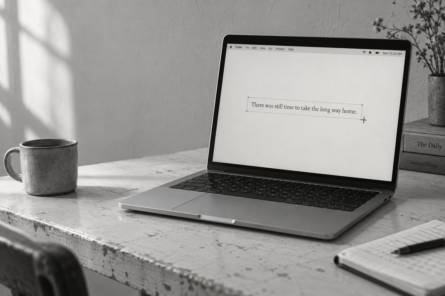 Monochrome laptop product photograph showing text selection